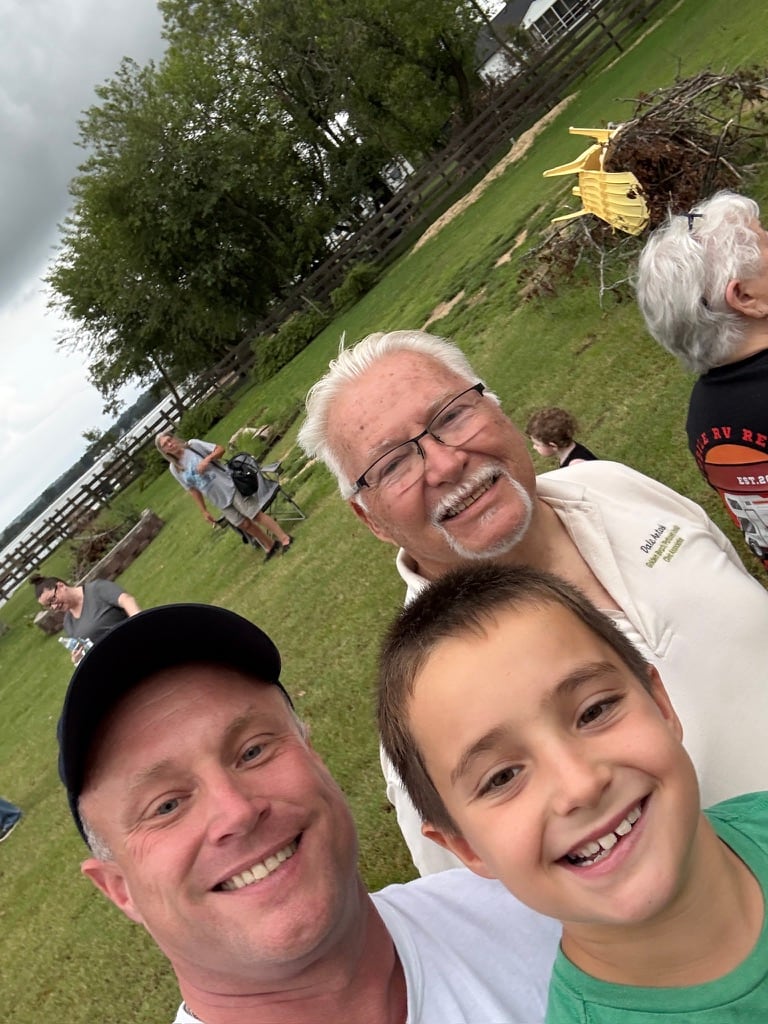 John O’Connor with community members at an outdoor gathering