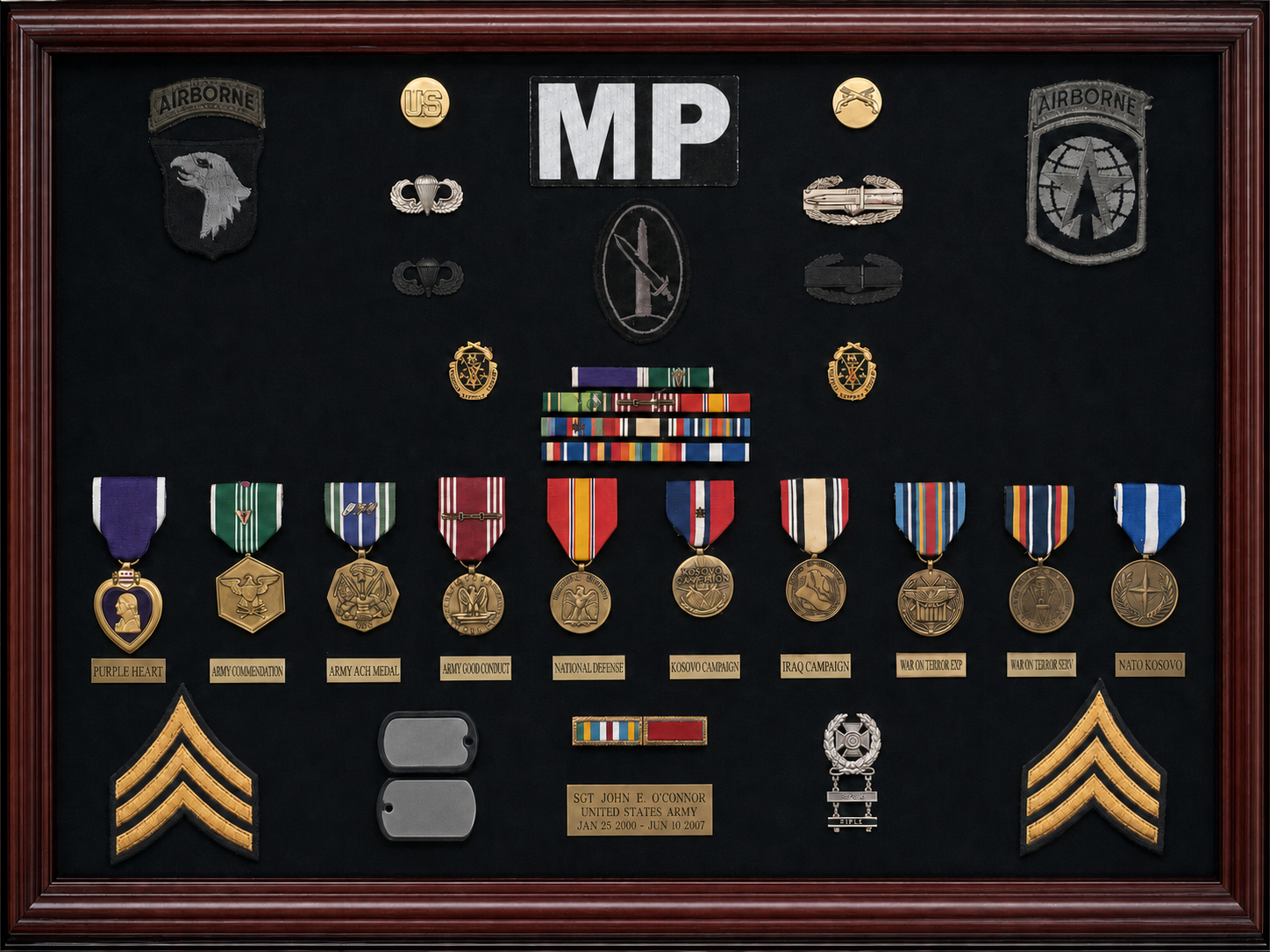 Framed U.S. Army awards and service display for Sgt. John E. O’Connor with dog-tag details removed