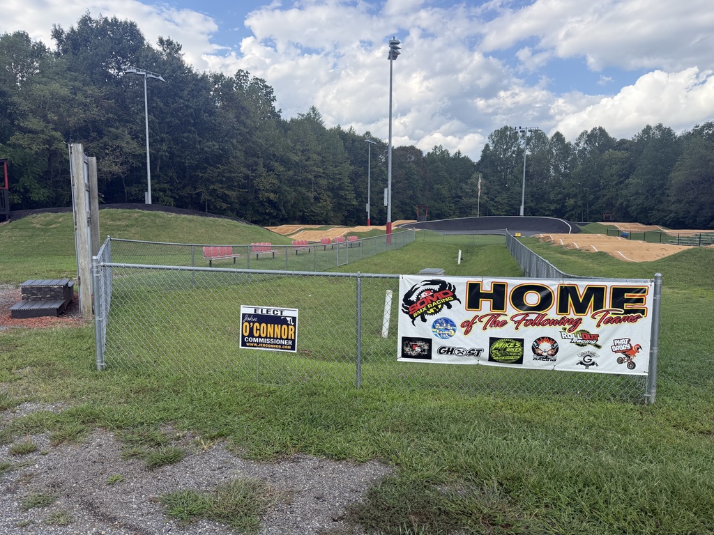 BMX track with a John O’Connor campaign sign on the fence