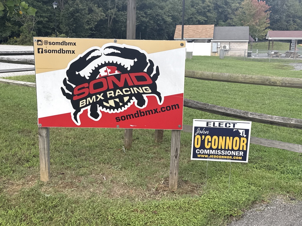 John O’Connor campaign sign beside the SOMD BMX Racing sign
