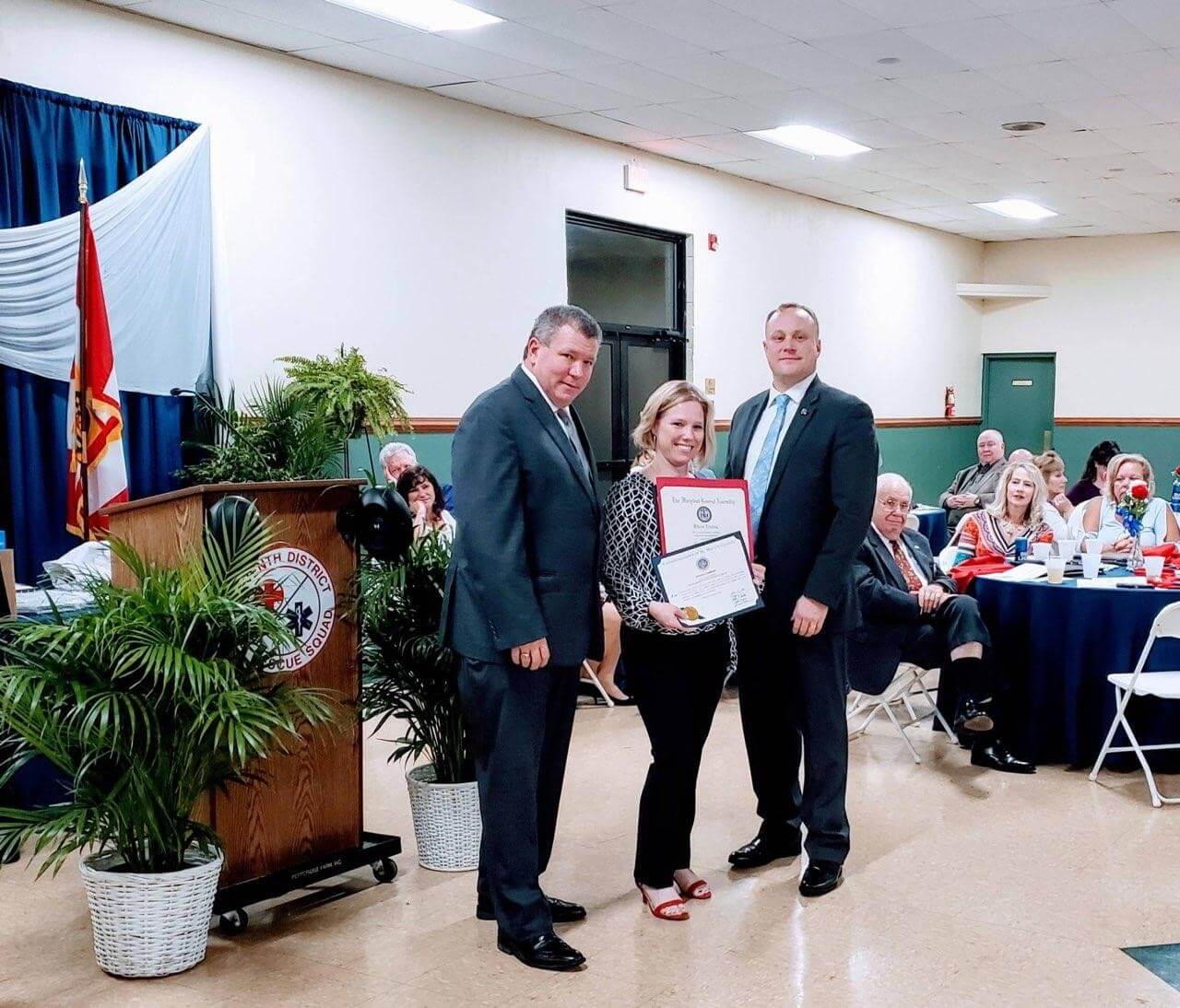 Recognition ceremony with certificates at a community event